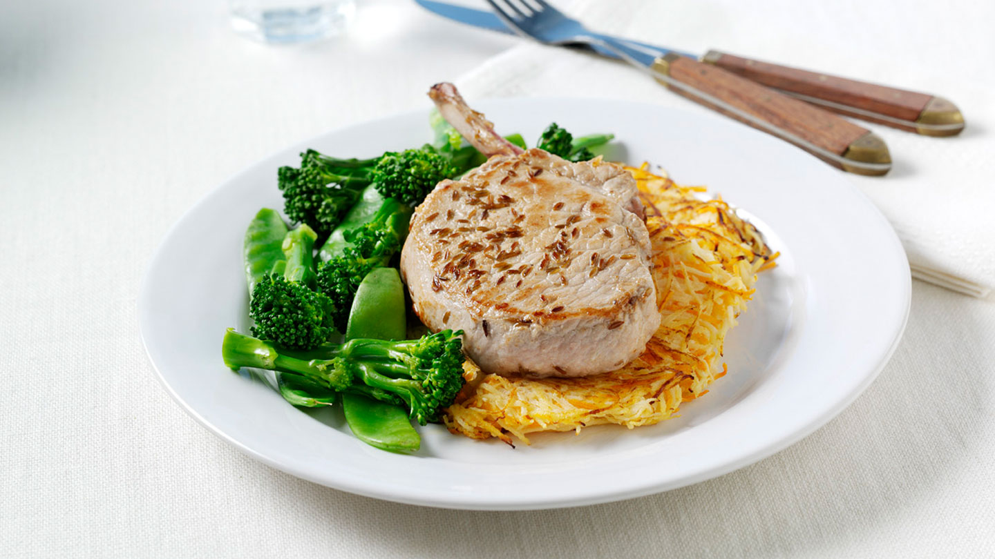 Pork loin chop on root vegetable rösti