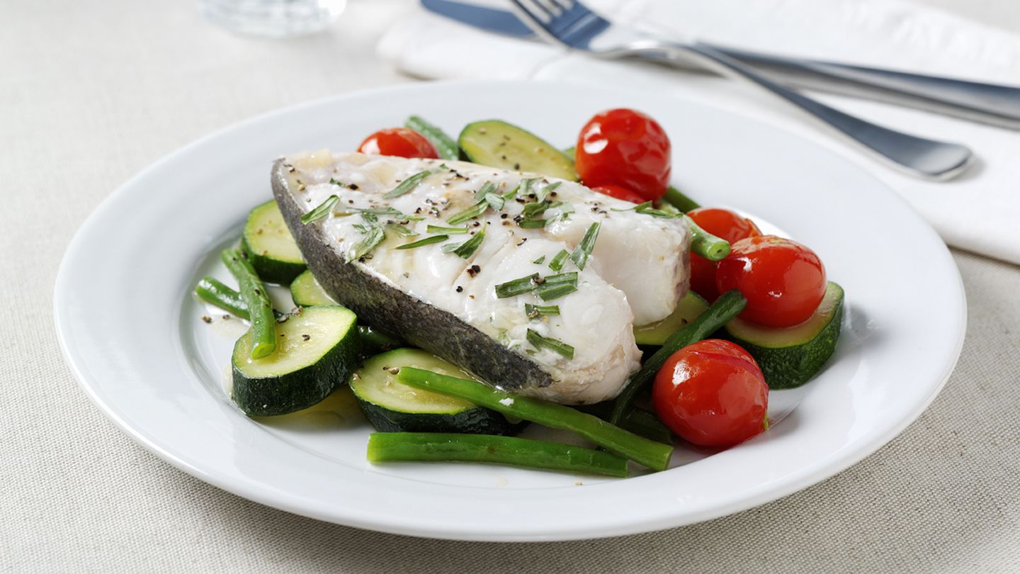 Tarragon-baked halibut with summer vegetables