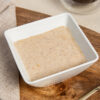 VLCD apple and cinnamon porridge in a square white bowl