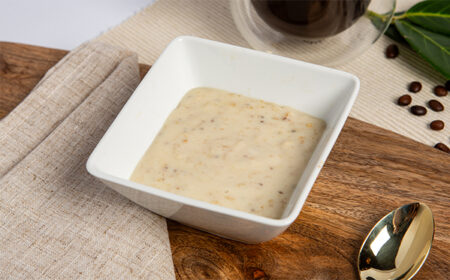 banana porridge meal replacement in a square white bowl