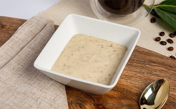 banana porridge meal replacement in a square white bowl