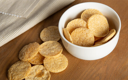 salt vingar popped chips in a white bowl and scattered on table